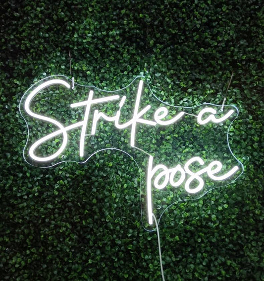 Strike a pose Neon Sign