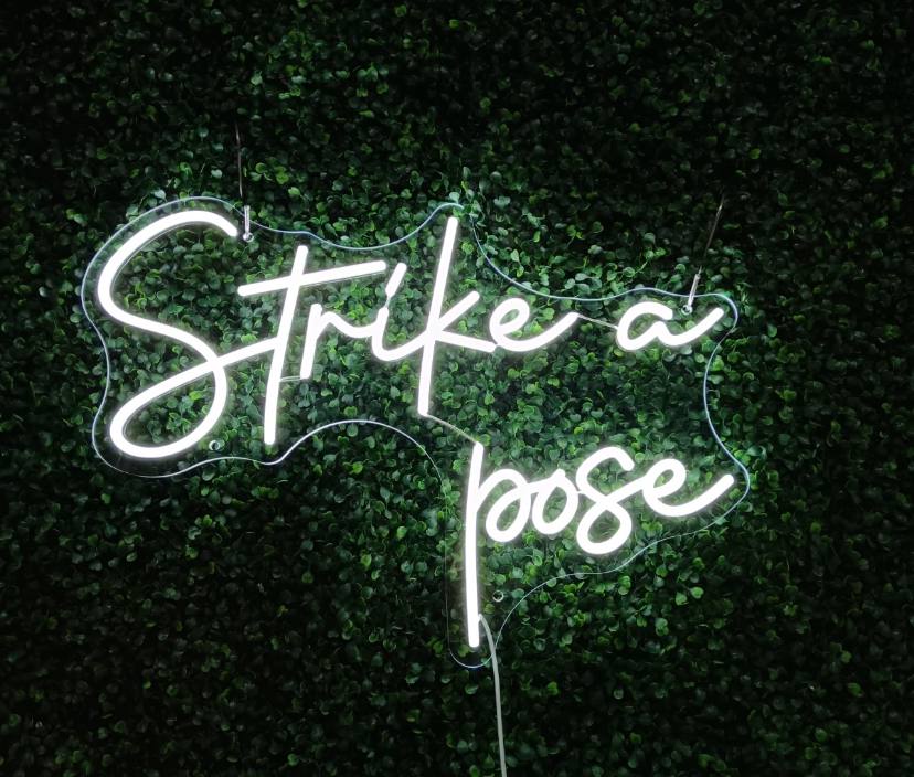 Strike a pose Neon Sign