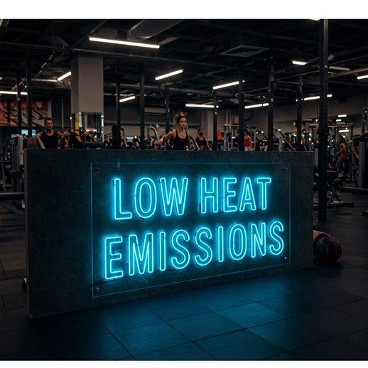 right blue LED neon sign reading 'Low Heat Emissions' in a modern gym setting, highlighting eco-friendly and energy-efficient lighting solutions for sustainable spaces