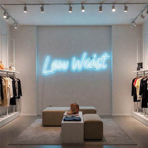 Elegant blue LED neon sign reading 'Low Waist' displayed in a chic boutique, adding a modern and stylish touch to a sophisticated retail space