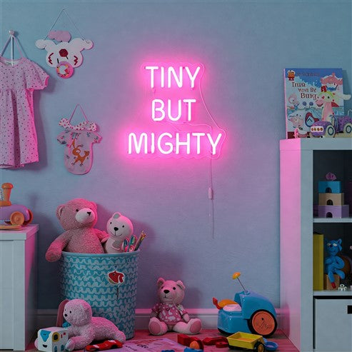 Children's room decorated with a pink neon sign reading 'Tiny But Mighty,' adding a playful and vibrant touch to the space while inspiring personality and charm