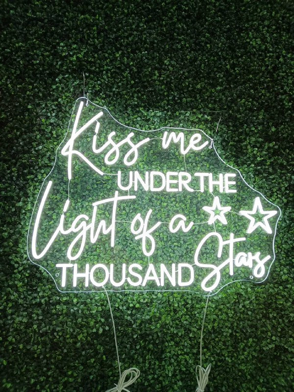 Kiss me under the light of a thousand stars neon sign