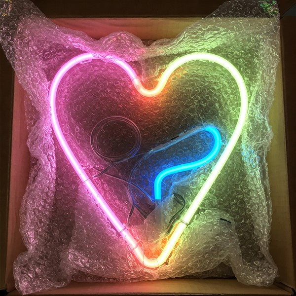 Neon Heart with Question Mark Sign | A vibrant LED neon heart and question mark sign, securely packed for delivery. Custom-designed neon lights for unique decor and gifting!